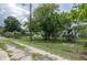 View of fenced backyard and side yard access, offering privacy and outdoor space at 760 72Nd N Ave, St Petersburg, FL 33702