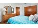 Bedroom with classic wood furniture including dresser and neutral walls at 760 72Nd N Ave, St Petersburg, FL 33702