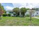 Charming single-story home featuring a well-maintained lawn, mature trees and landscaping at 760 72Nd N Ave, St Petersburg, FL 33702