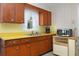Bright kitchen featuring ample counter space, wooden cabinets, and a classic design at 760 72Nd N Ave, St Petersburg, FL 33702