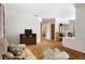 Comfortable living room featuring a cozy sofa, plush armchair, tv and glass coffee table at 760 72Nd N Ave, St Petersburg, FL 33702