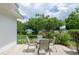 Charming patio area surrounded by lush greenery and colorful plants at 760 72Nd N Ave, St Petersburg, FL 33702