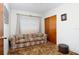 Sitting room with a comfortable couch and neutral-colored walls at 760 72Nd N Ave, St Petersburg, FL 33702