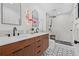 Modern bathroom boasts a double sink vanity, sleek fixtures, and a glass-enclosed shower at 8010 Par N Ave, St Petersburg, FL 33710