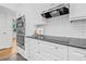Modern kitchen boasts stainless steel appliances, sleek black countertops, and white subway tile backsplash at 8010 Par N Ave, St Petersburg, FL 33710