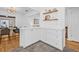Bright kitchen featuring white cabinetry, modern hardware, and a pass-through to the dining area at 8010 Par N Ave, St Petersburg, FL 33710