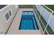 Modern pool design featuring clean lines and integrated water features at 8010 Par N Ave, St Petersburg, FL 33710