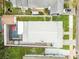 Drone view showing property layout, backyard with pool and neighboring houses at 904 E Hamilton Ave, Tampa, FL 33604