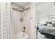 New shower and tiling in the bathroom with an ensuite to the main bedroom at 904 E Hamilton Ave, Tampa, FL 33604