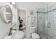 Bright bathroom boasts a stylish shower with a glass enclosure and modern fixtures at 904 E Hamilton Ave, Tampa, FL 33604