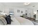 Bright bedroom featuring neutral décor, comfortable seating, and plenty of natural light at 904 E Hamilton Ave, Tampa, FL 33604