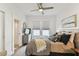 Light and bright bedroom with a ceiling fan and ensuite bathroom at 904 E Hamilton Ave, Tampa, FL 33604