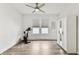 Spacious bedroom with wood-look floors, abundant natural light, and closet storage at 904 E Hamilton Ave, Tampa, FL 33604