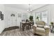 Inviting dining area featuring a stylish table, neutral decor, and convenient access to front door at 904 E Hamilton Ave, Tampa, FL 33604