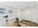 Entryway with wood floors and large window with window treatments at 904 E Hamilton Ave, Tampa, FL 33604