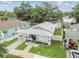 Charming single-story home featuring a well-maintained lawn and inviting walkway at 904 E Hamilton Ave, Tampa, FL 33604