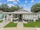 Charming home with beautiful landscaping, brick walkway, a covered porch, and inviting curb appeal at 904 E Hamilton Ave, Tampa, FL 33604