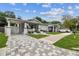 Charming home featuring a quaint front porch, freshly painted exterior, and beautifully manicured landscaping at 904 E Hamilton Ave, Tampa, FL 33604