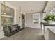 Charming front porch with a swing, lovely plants, and lots of space to relax and enjoy the day at 904 E Hamilton Ave, Tampa, FL 33604