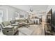 Open-concept living room features hardwood floors and flows into a modern kitchen at 904 E Hamilton Ave, Tampa, FL 33604
