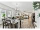 Open-concept living space with neutral décor seamlessly connects dining, living, and kitchen areas at 904 E Hamilton Ave, Tampa, FL 33604