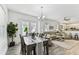Expansive open-concept area connecting dining, living, and kitchen spaces filled with natural light at 904 E Hamilton Ave, Tampa, FL 33604