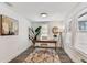 Office space featuring a decorative rug, wood floors, and a large plant at 904 E Hamilton Ave, Tampa, FL 33604