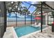 Sparkling pool featuring stylish chairs under a covered patio at 904 E Hamilton Ave, Tampa, FL 33604