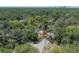 Aerial view of a home on a corner lot, surrounded by lush green trees at 917 W Idlewild Ave, Tampa, FL 33604