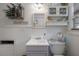 Well-lit bathroom featuring beadboard paneling, vanity, and decorative accents at 917 W Idlewild Ave, Tampa, FL 33604