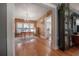 Open layout showcasing the dining room with hardwood floors, chandelier, and natural light at 917 W Idlewild Ave, Tampa, FL 33604