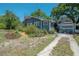 Charming single-Gathering home with mature landscaping and a detached garage at 917 W Idlewild Ave, Tampa, FL 33604
