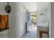 Bright laundry room with black accents, patterned tiled floor and direct backyard access at 917 W Idlewild Ave, Tampa, FL 33604