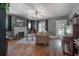 Cozy living room with a fireplace, hardwood floors, and a comfortable seating area at 917 W Idlewild Ave, Tampa, FL 33604