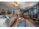 Spacious living room with hardwood floors, a comfortable sofa, and built-in bookshelves at 917 W Idlewild Ave, Tampa, FL 33604