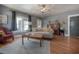 Bright living room with hardwood floors, a comfortable couch, and large windows at 917 W Idlewild Ave, Tampa, FL 33604
