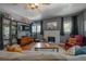 Inviting living room with a fireplace, built-in shelving, and comfortable seating arrangements at 917 W Idlewild Ave, Tampa, FL 33604