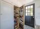View of pantry with shelving in laundry room at 917 W Idlewild Ave, Tampa, FL 33604