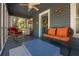 Charming screened porch with comfortable seating and decorative details at 917 W Idlewild Ave, Tampa, FL 33604