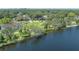 Beautiful waterfront property surrounded by lush greenery and serene water views at 917 W Idlewild Ave, Tampa, FL 33604