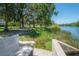 Waterfront park featuring benches, grassy areas, and a serene lake view at 917 W Idlewild Ave, Tampa, FL 33604