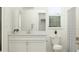 Bright bathroom with a quartz vanity, framed mirror, and tiled shower with curtain and natural light at 9542 Minnow Ray Dr, Land O Lakes, FL 34638