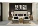 Well-lit staged primary bedroom showcasing a decorative accent wall and neutral furniture at 9542 Minnow Ray Dr, Land O Lakes, FL 34638