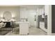 Modern kitchen with white cabinetry, stainless steel appliances, and island with bar seating at 9542 Minnow Ray Dr, Land O Lakes, FL 34638