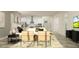 Open-concept living space featuring a comfortable sofa, modern decor, and connecting kitchen area at 9542 Minnow Ray Dr, Land O Lakes, FL 34638