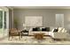 Comfortable living room featuring a plush sofa, accent chairs, and stylish decor at 9542 Minnow Ray Dr, Land O Lakes, FL 34638