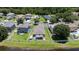 Aerial view of a home with a fenced yard, patio, and a small boat parked in the backyard at 9831 Edmonton Dr, Land O Lakes, FL 34638