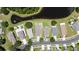 Stunning aerial shot of a neighborhood with lush landscaping and a serene lake nearby at 9831 Edmonton Dr, Land O Lakes, FL 34638