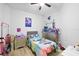 Bright bedroom with themed décor, fun accents, and ample storage, perfect for a or teenager at 9831 Edmonton Dr, Land O Lakes, FL 34638