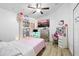 Fun bedroom with unique décor, bright colors, and ample storage, perfect for a or teenager at 9831 Edmonton Dr, Land O Lakes, FL 34638